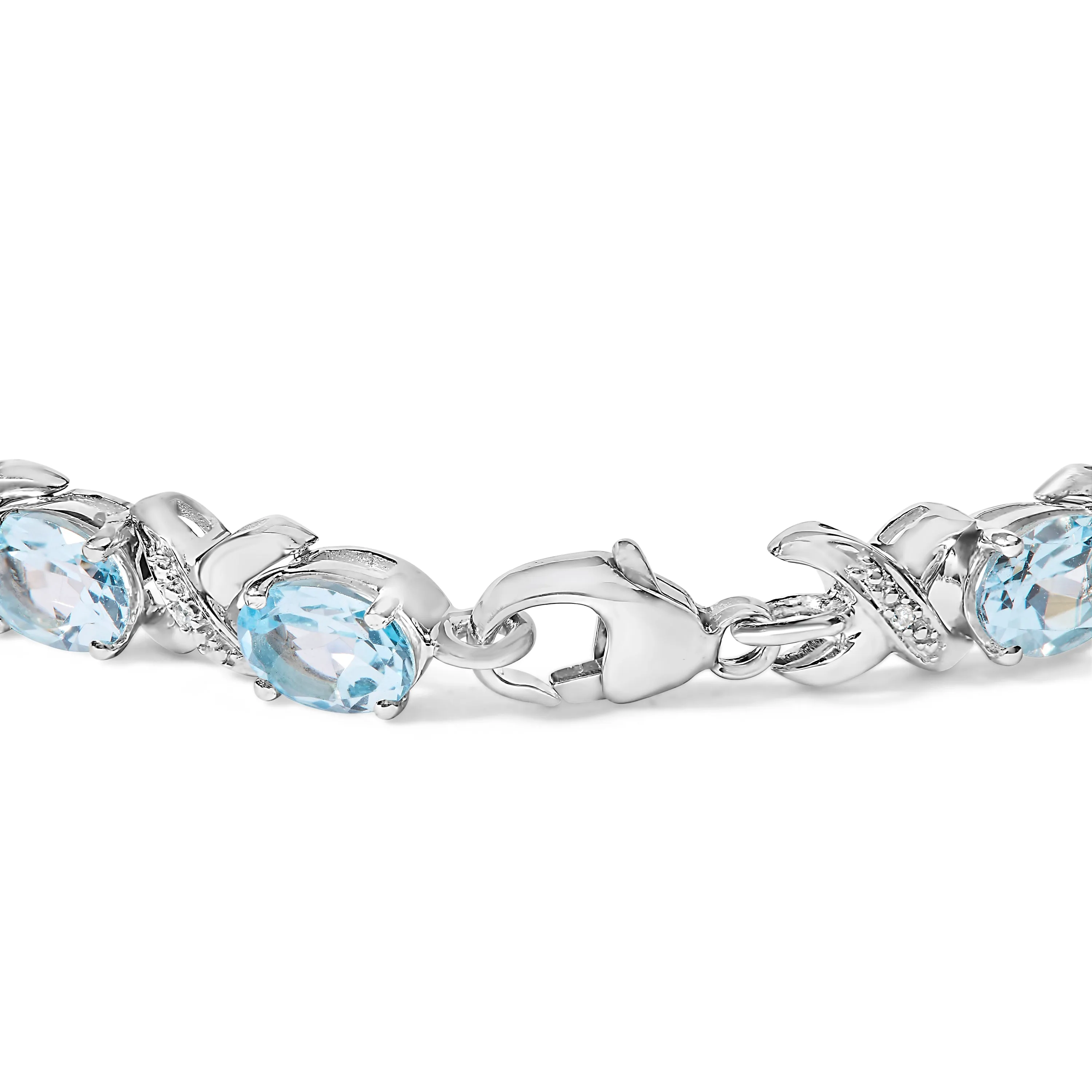 .925 Sterling Silver 16.0 Cttw Oval Blue Topaz and Diamond Accent Tennis X Link Bracelet