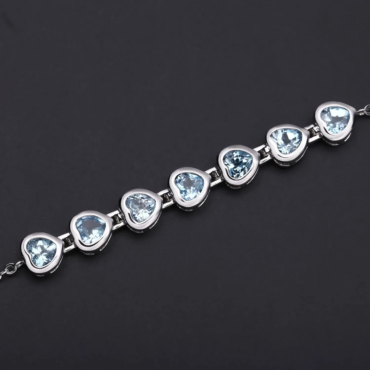 Row of Heart Shape Natural Blue Topaz Silver Bracelet