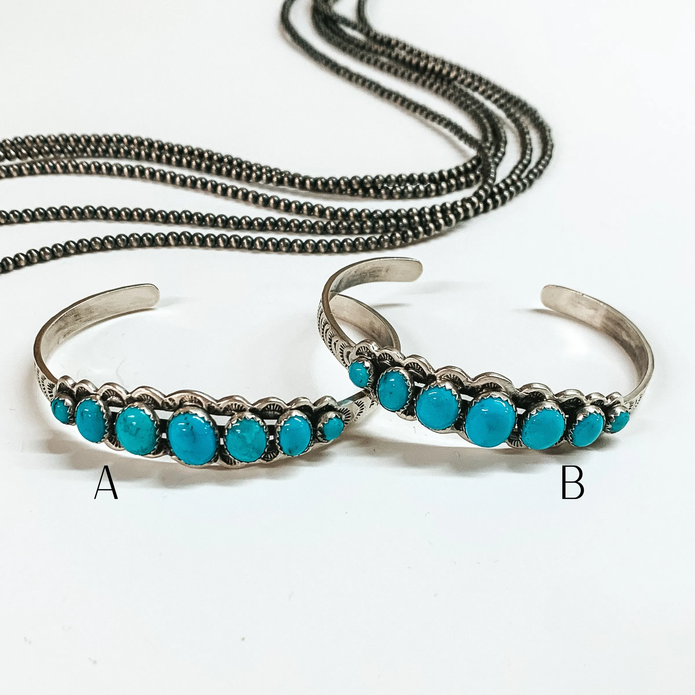 Russell Sam | Navajo Handmade Sterling Silver Cuff Bracelet with Seven Turquoise Stones